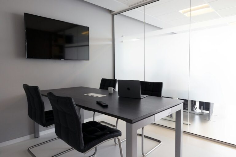 Meeting room with a wall-mounted screen
