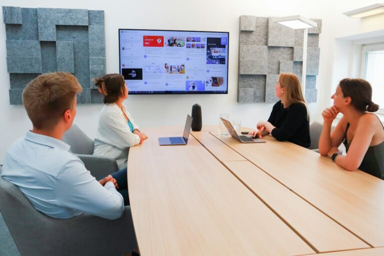 Team meeting in a smart meeting room with a large display – Sky Data Show